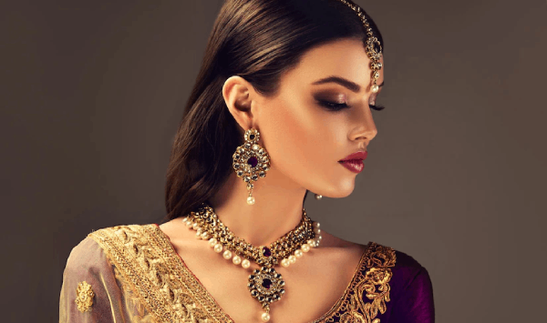 women wear earrings and necklace